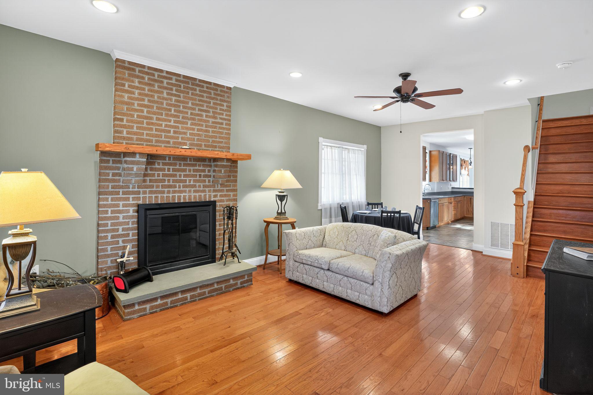 9260 Old Scaggsville Road Laurel, MD 20723 - Photo 2 of 48 a living room with furniture and a fireplace