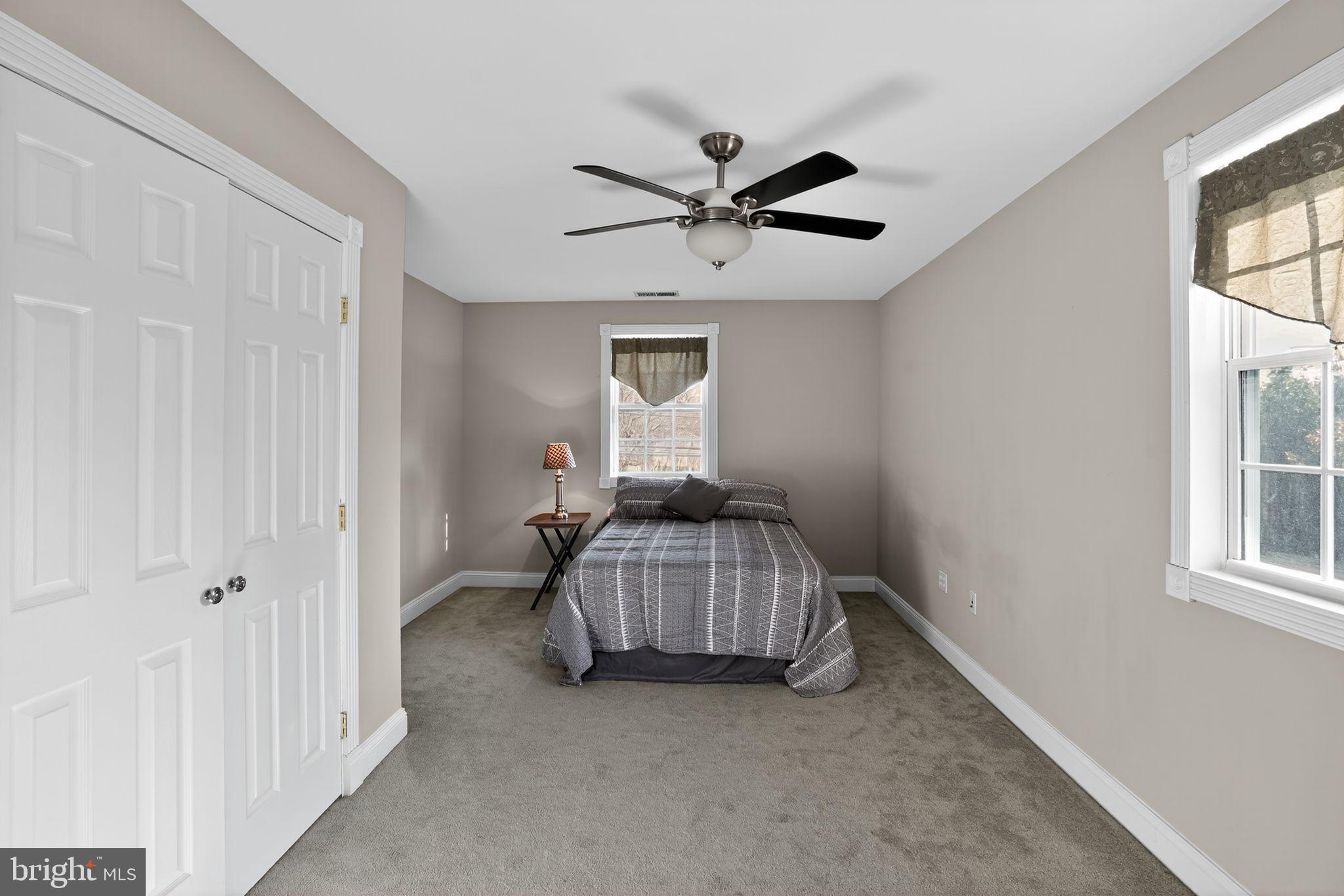 9260 Old Scaggsville Road Laurel, MD 20723 - Photo 29 of 48 a bedroom with a bed and a window