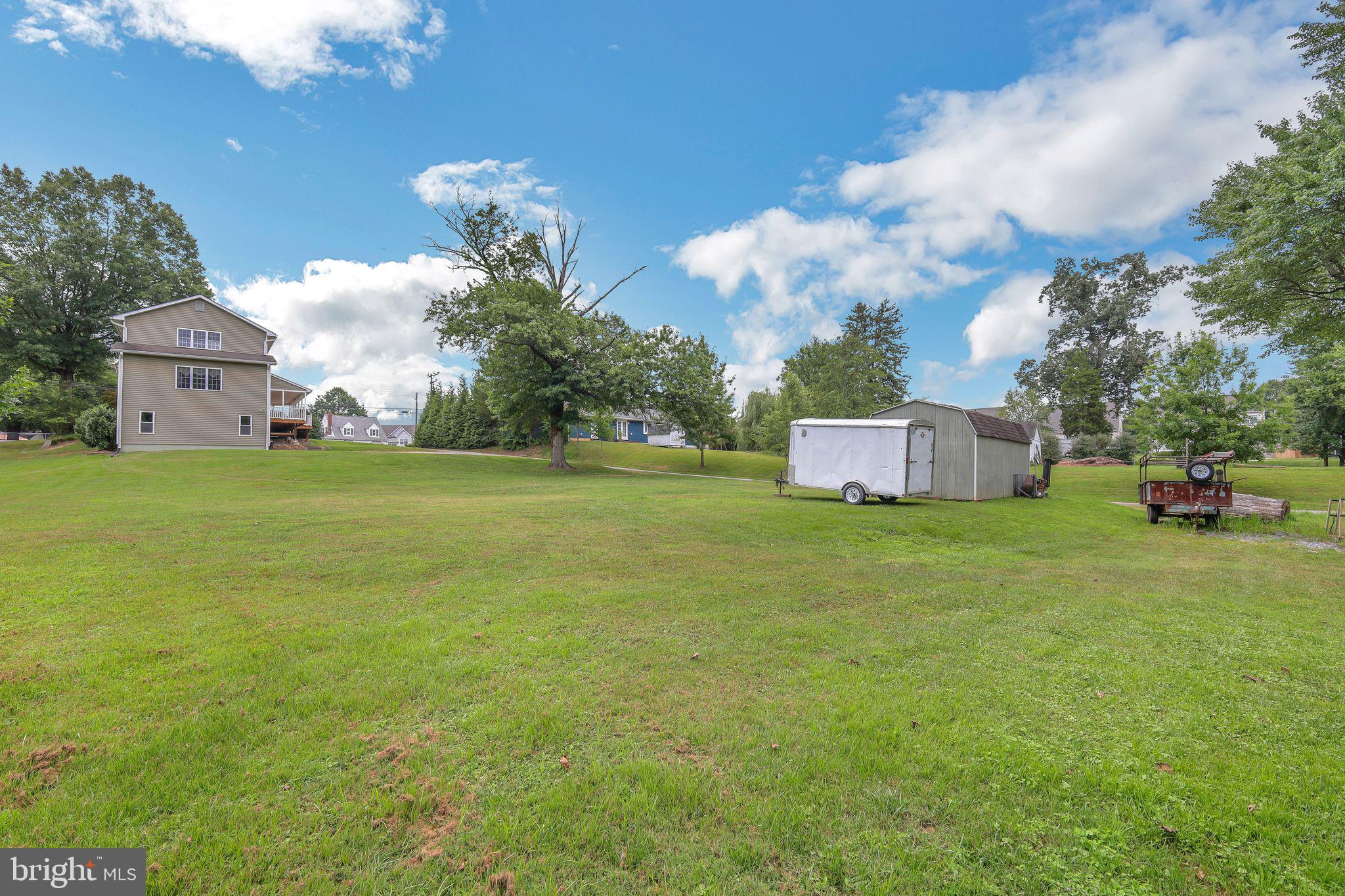 9260 Old Scaggsville Road Laurel, MD 20723 - Photo 46 of 48 a front view of a house with a garden and deck