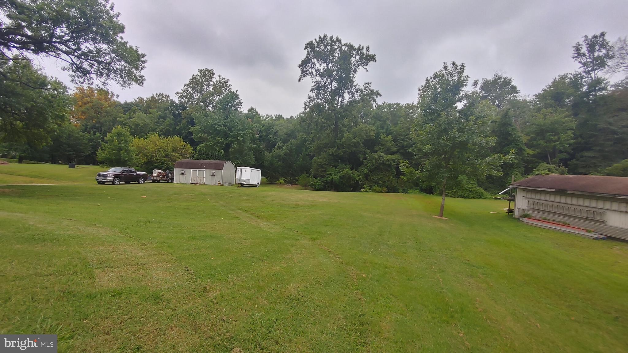 9260 Old Scaggsville Road Laurel, MD 20723 - Photo 47 of 48 a view of a house with a yard and sitting area