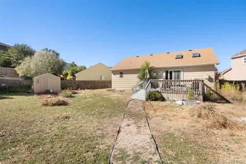 a view of a backyard with a sitting area