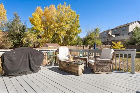 a view of a balcony with chairs