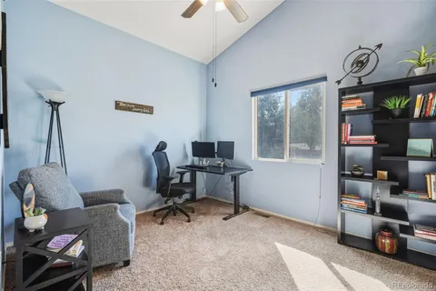 a work room with furniture and a window