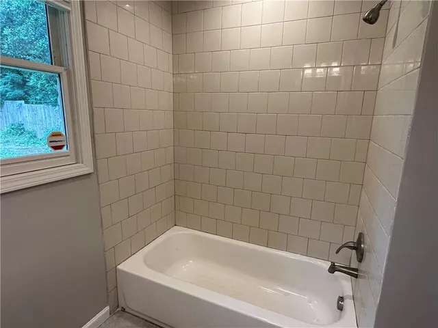 a bathroom with a toilet a sink and a mirror