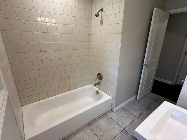 a bathroom with a sink a toilet and a bathtub