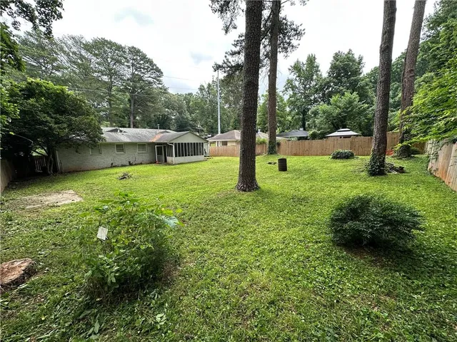 a backyard of a house with lots of green space