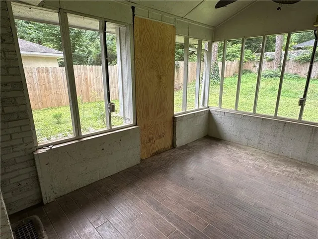 a view of an empty room with a window
