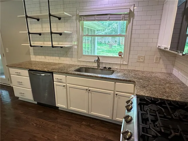 a kitchen with a sink and a window