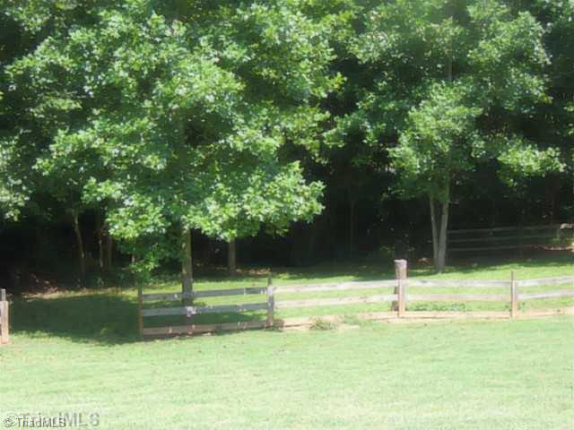 2081 Soapstone Mountain Road Staley, NC 27355 - Photo 2 of 10 Land/Lot. side view with fence