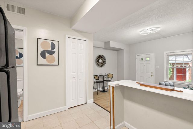 a bedroom with a bed and a table