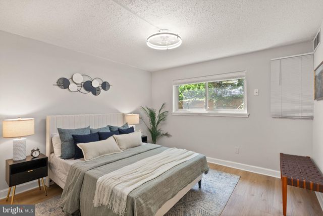 a bedroom with bed and a window