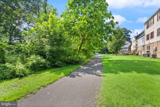 a view of a street with a building in the background