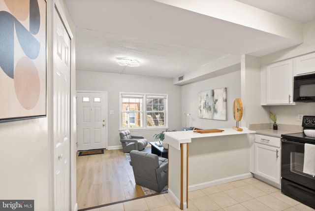 a view of a kitchen and dining room
