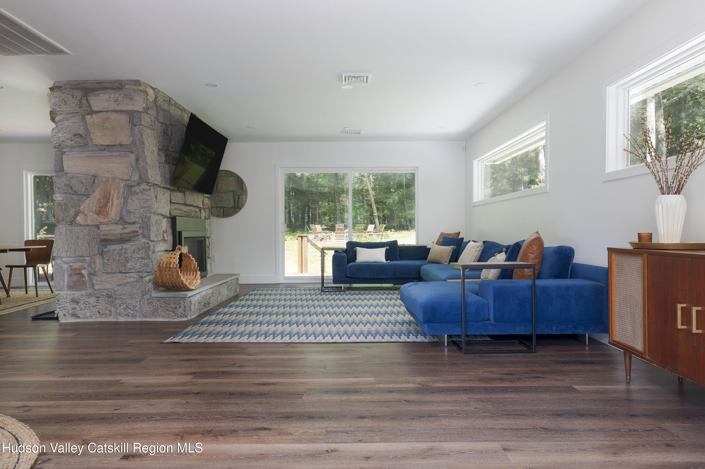 63 Lapla Road Kingston, NY 12401 - Photo 12 of 42 a living room with furniture and a flat screen tv