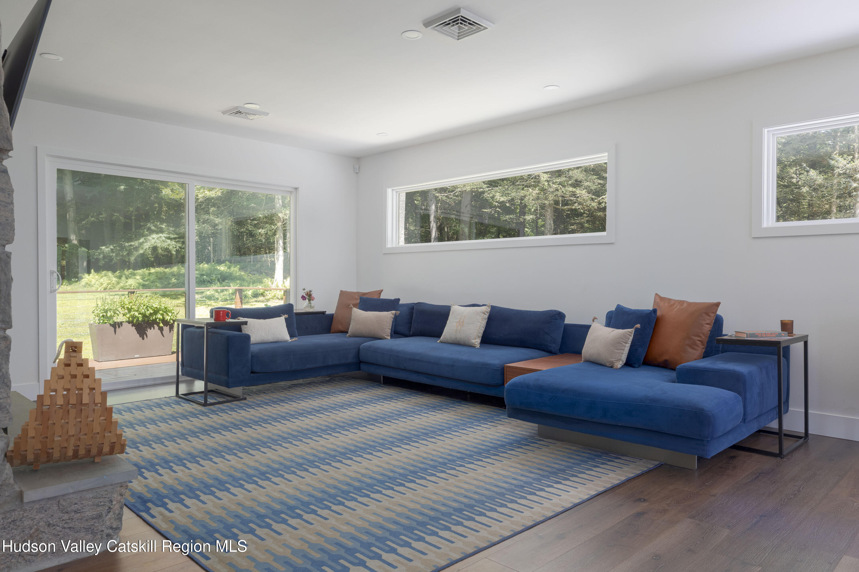 63 Lapla Road Kingston, NY 12401 - Photo 13 of 42 a living room with furniture and a large window