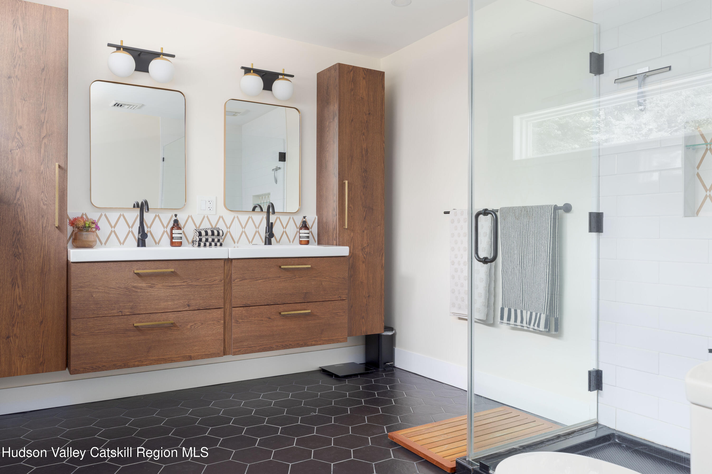 63 Lapla Road Kingston, NY 12401 - Photo 21 of 42 a bathroom with a sink a mirror and a shower