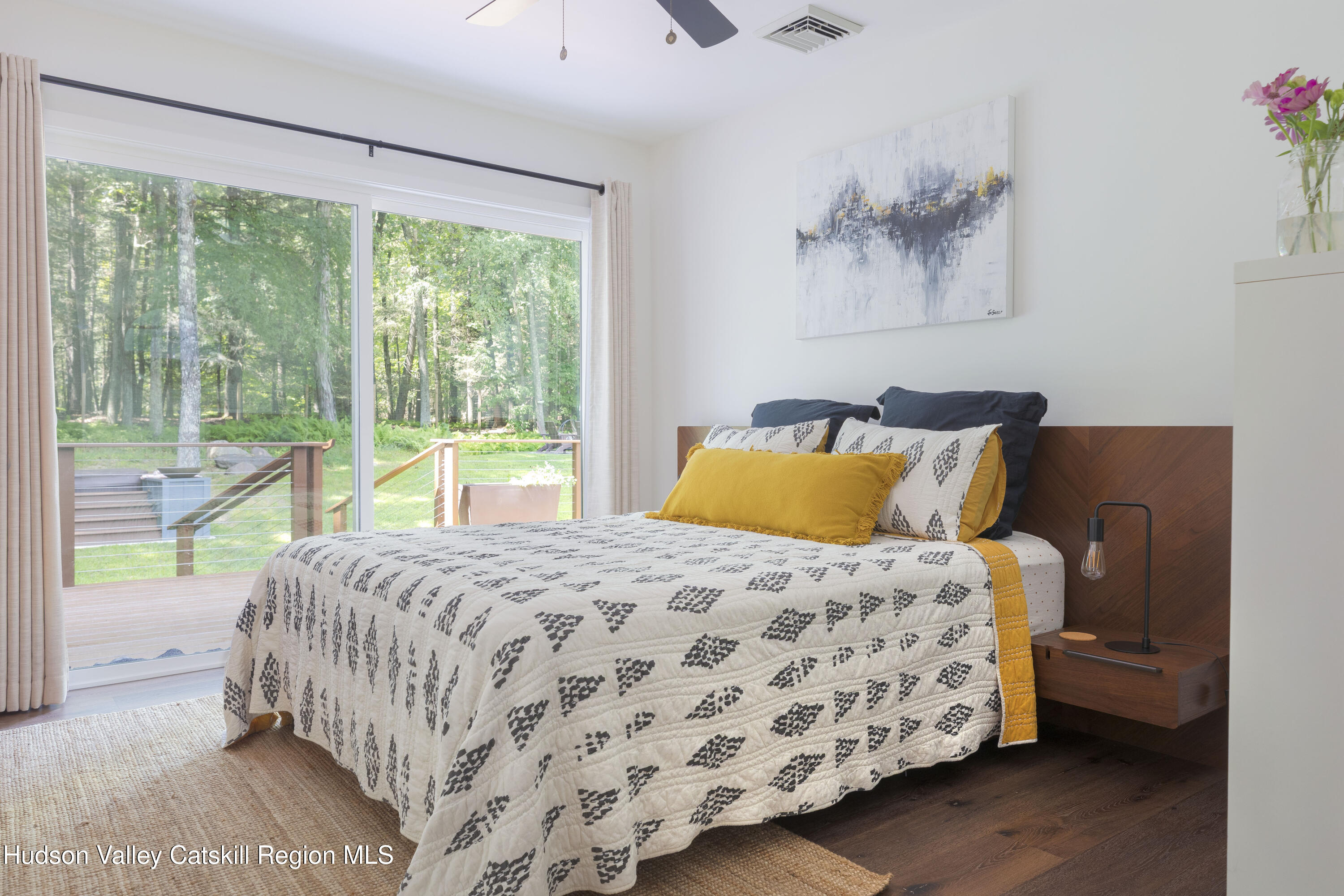 63 Lapla Road Kingston, NY 12401 - Photo 27 of 42 a bedroom with a bed and a painting on the wall