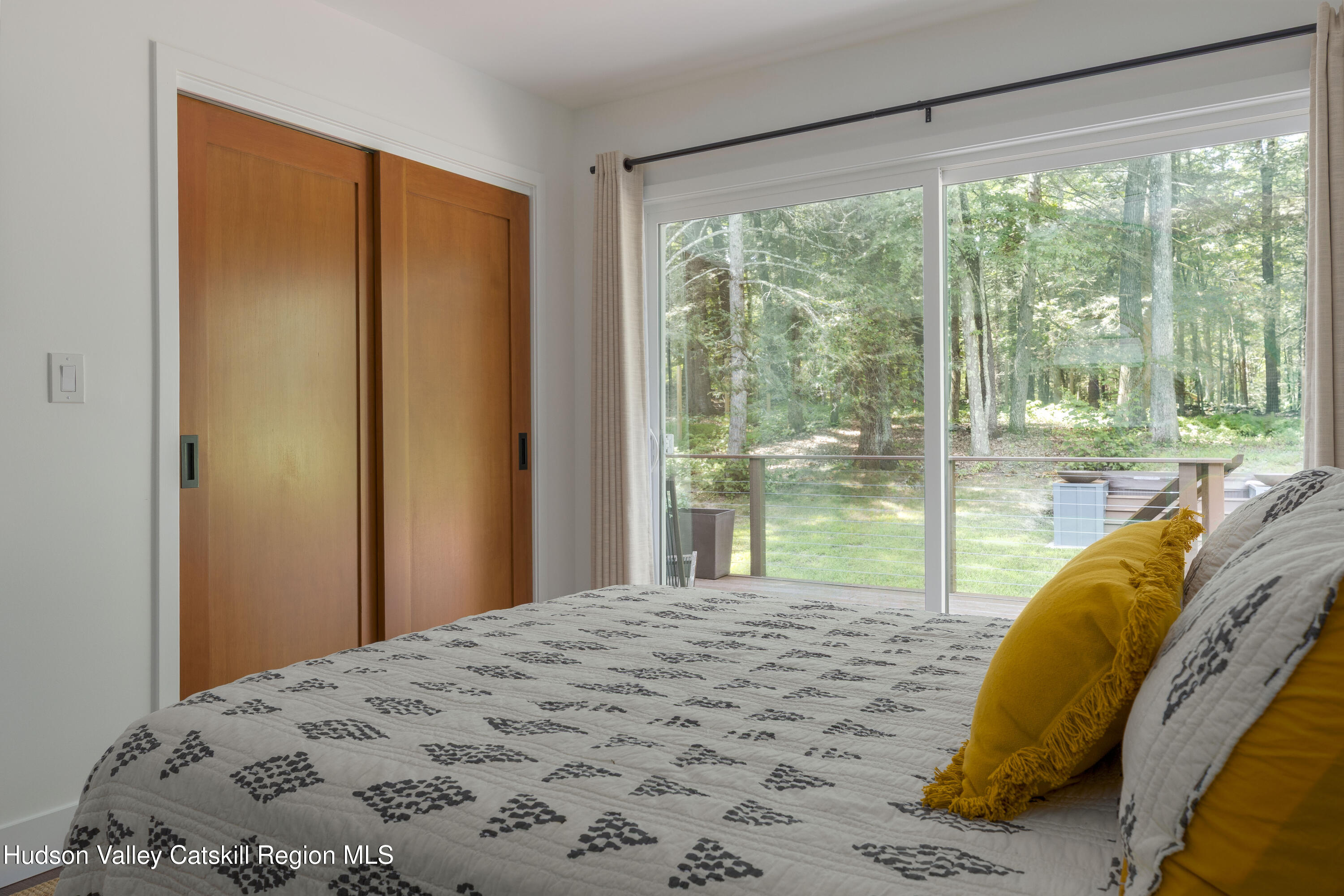 63 Lapla Road Kingston, NY 12401 - Photo 28 of 42 a bed sitting in a bedroom next to a window