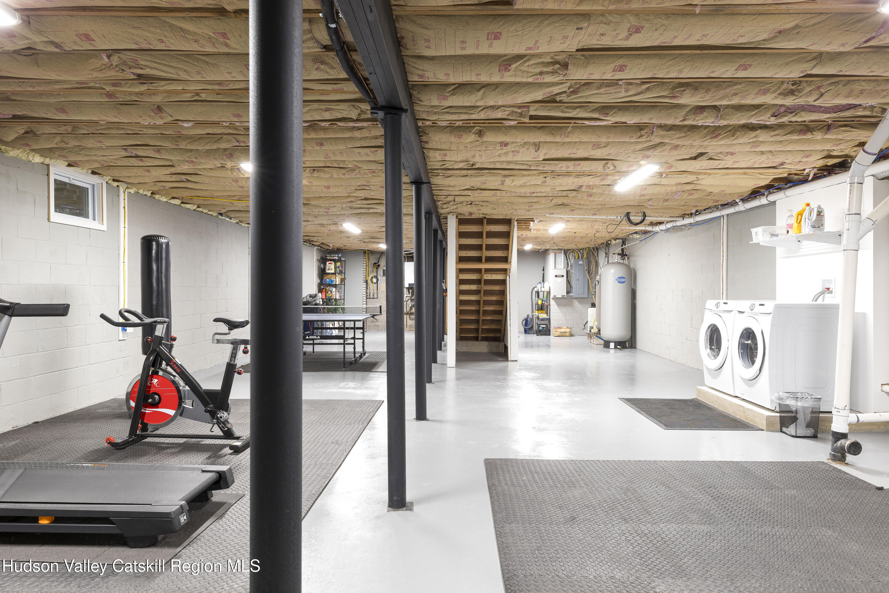 63 Lapla Road Kingston, NY 12401 - Photo 29 of 42 a view of a hallway with a couch and chandelier