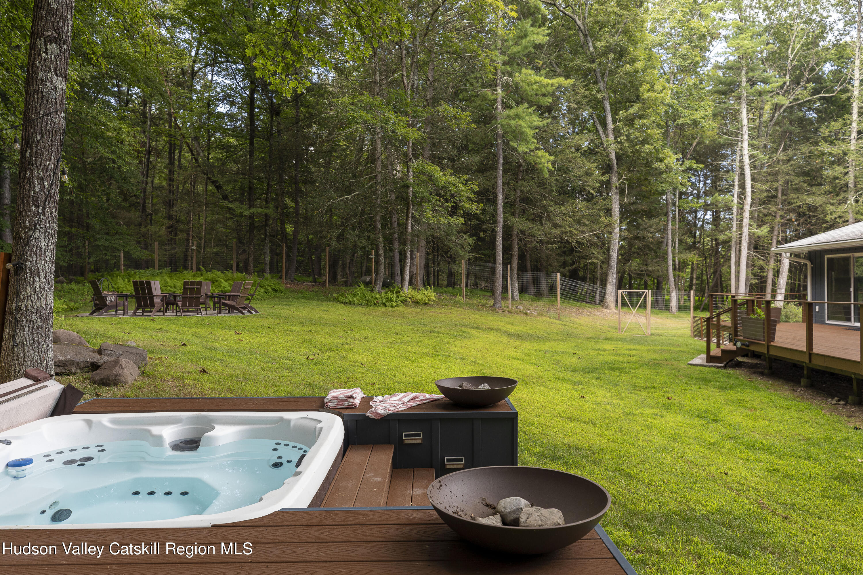 63 Lapla Road Kingston, NY 12401 - Photo 3 of 42 a backyard of a house with table and chairs