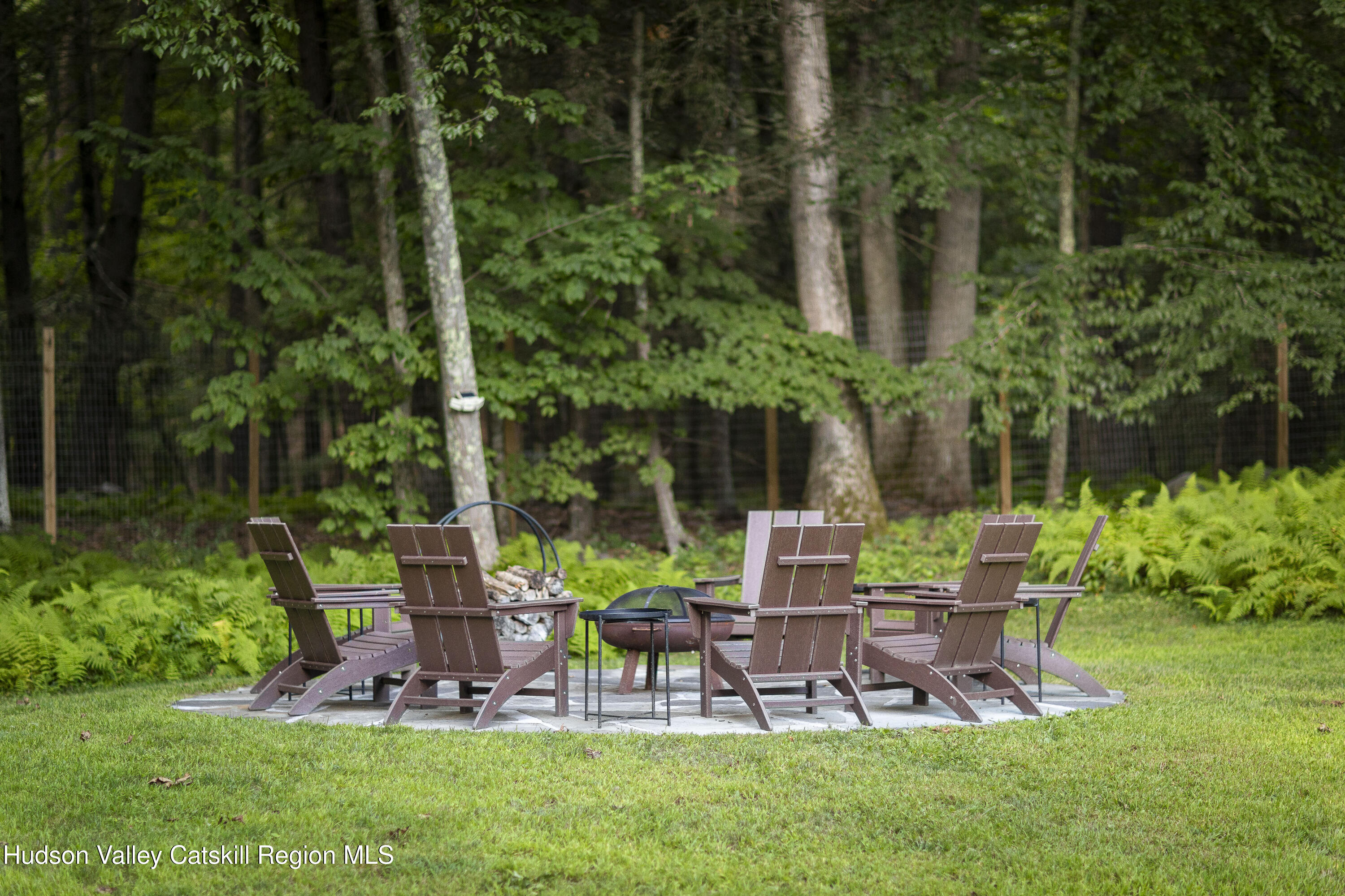 63 Lapla Road Kingston, NY 12401 - Photo 38 of 42 a view of a chair and table in backyard of the house