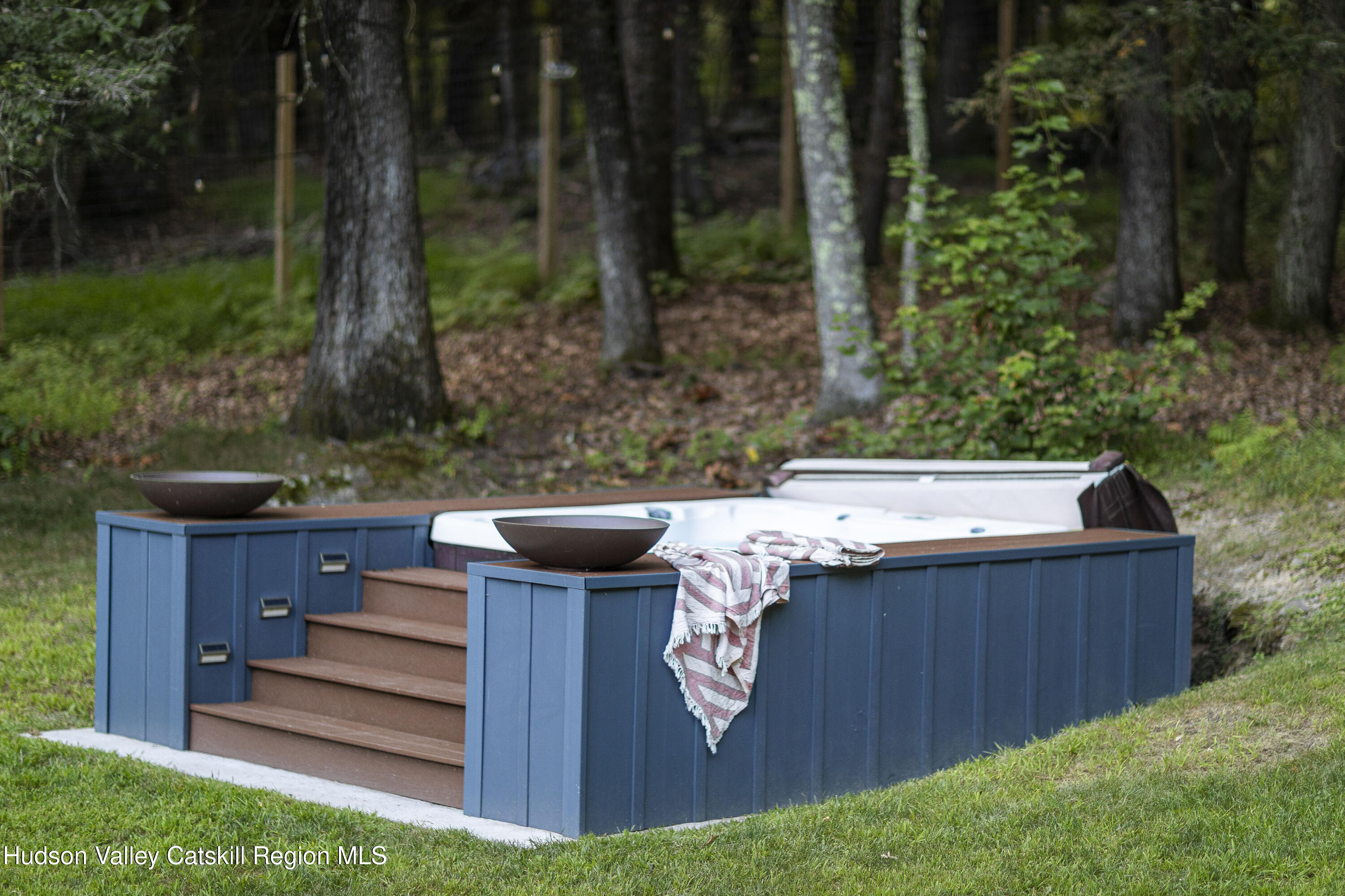 63 Lapla Road Kingston, NY 12401 - Photo 39 of 42 a view of a backyard with plants and outdoor seating