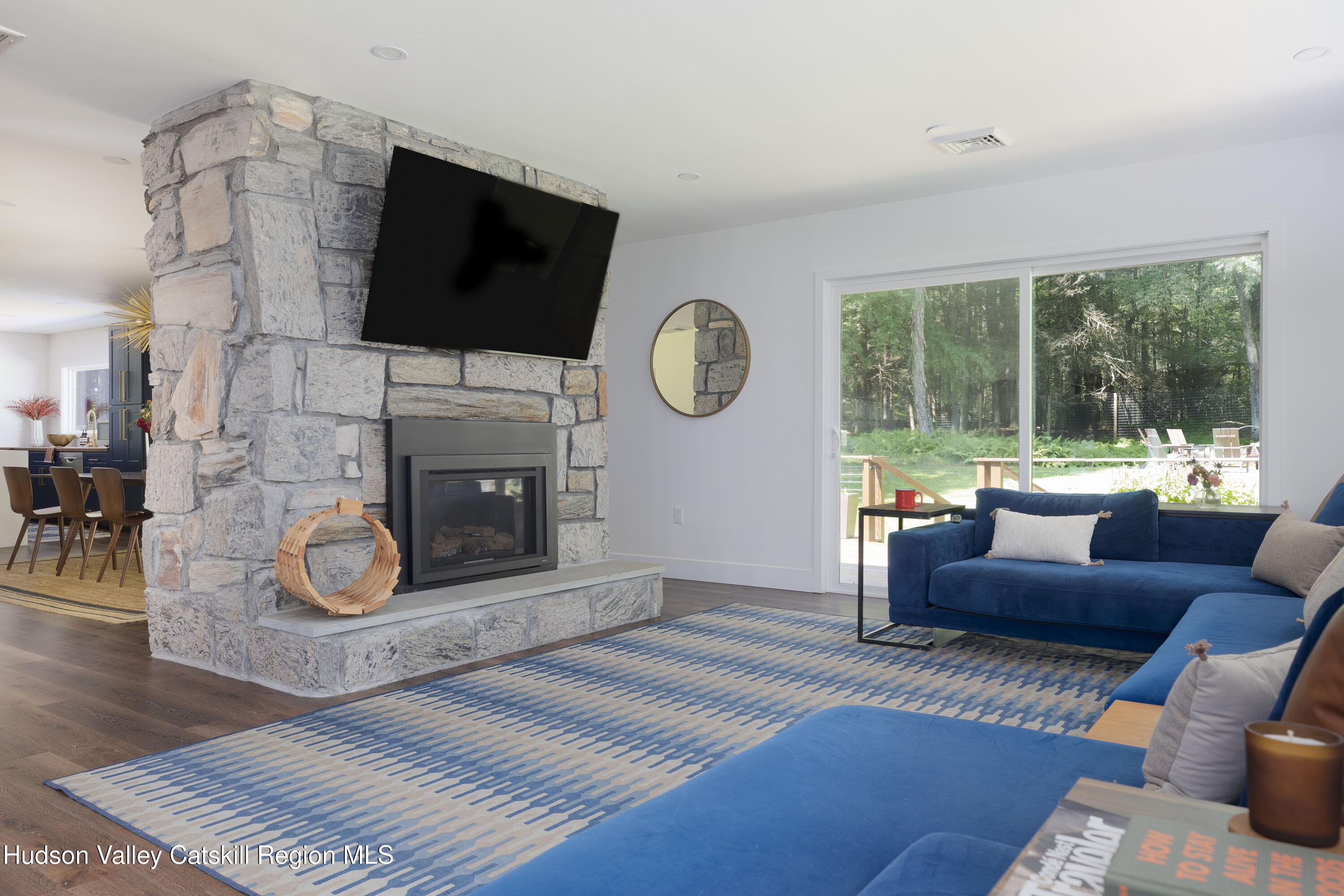 63 Lapla Road Kingston, NY 12401 - Photo 4 of 42 a living room with furniture a fireplace and a flat screen tv