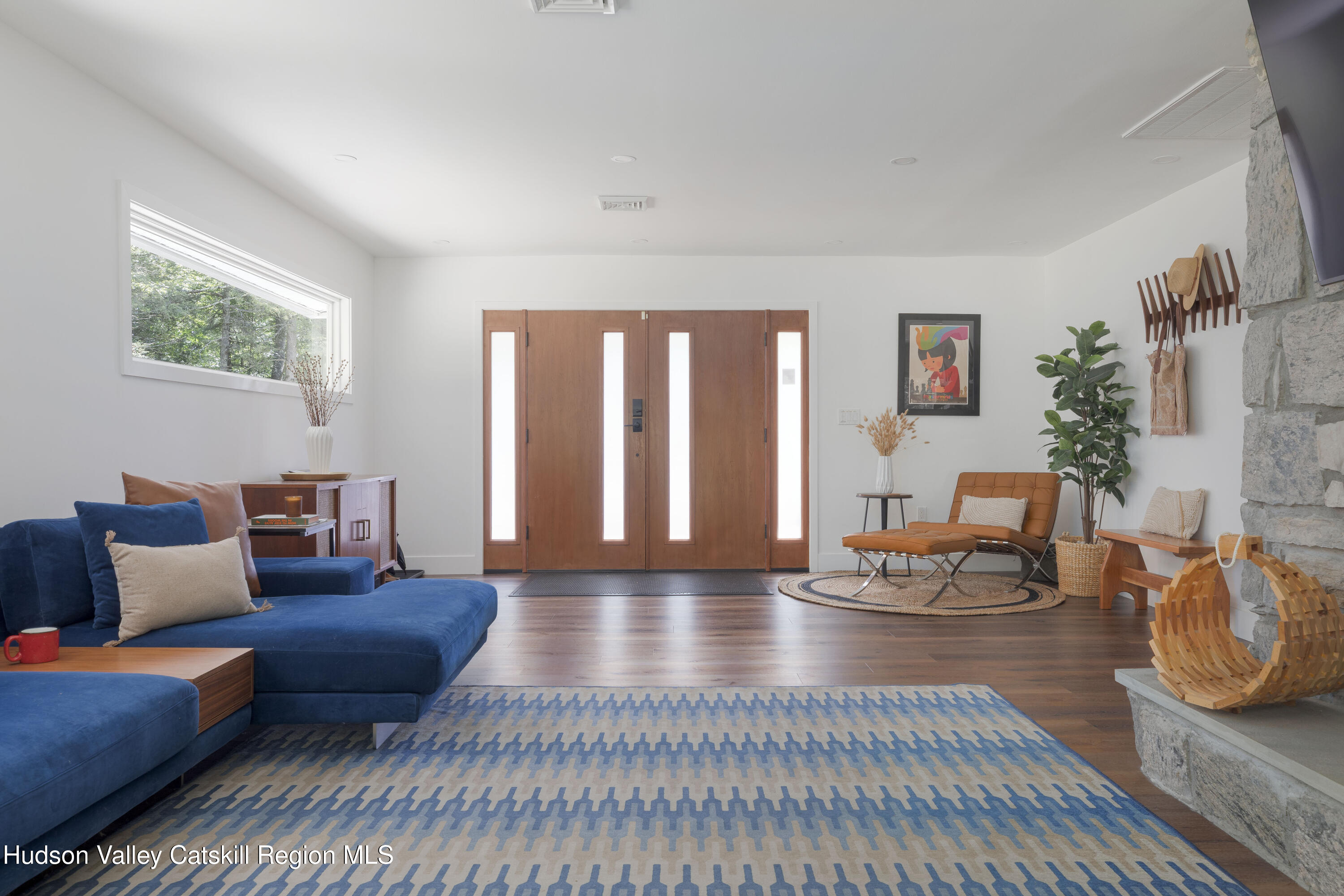 63 Lapla Road Kingston, NY 12401 - Photo 9 of 42 a living room with furniture and a wooden floor