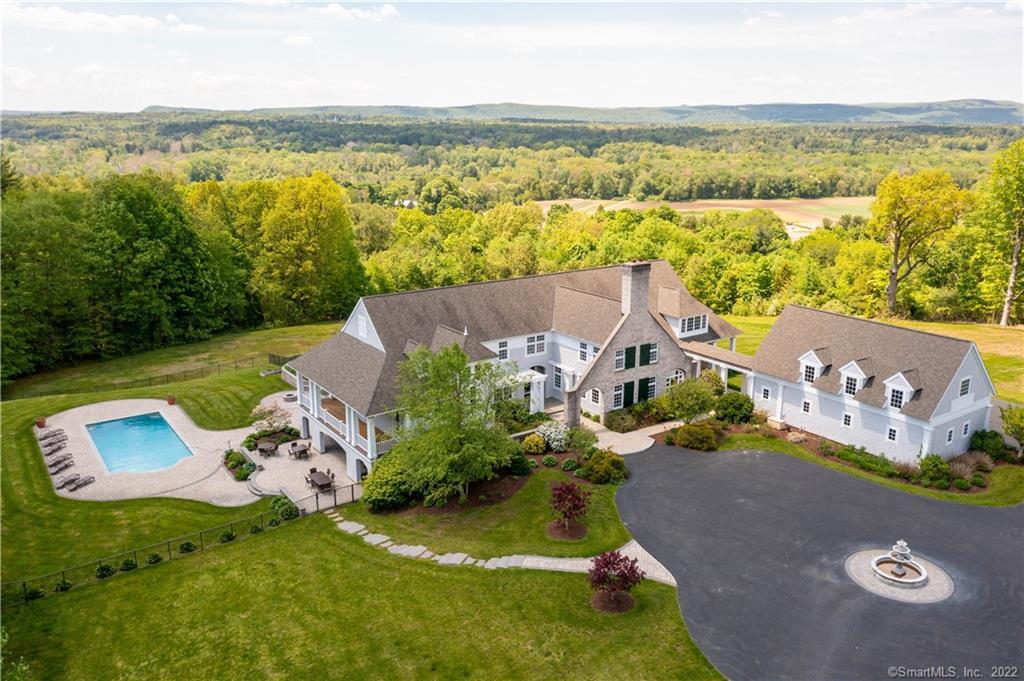 an aerial view of a house with a lake view