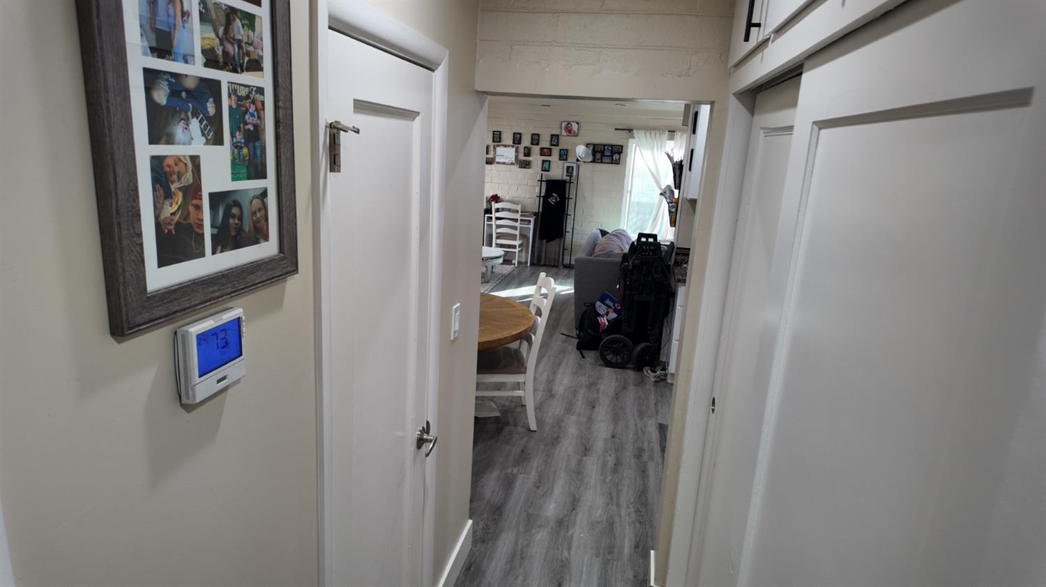 129 Phoenix Avenue Modesto, CA 95354 - Photo 15 of 21 a view of a hallway with wooden shelves