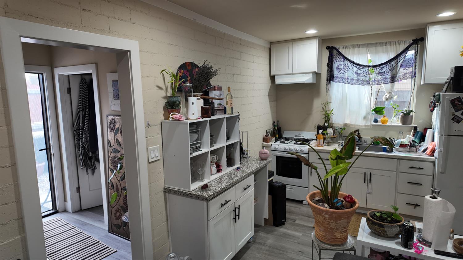 129 Phoenix Avenue Modesto, CA 95354 - Photo 17 of 21 a kitchen with a sink stove and cabinets