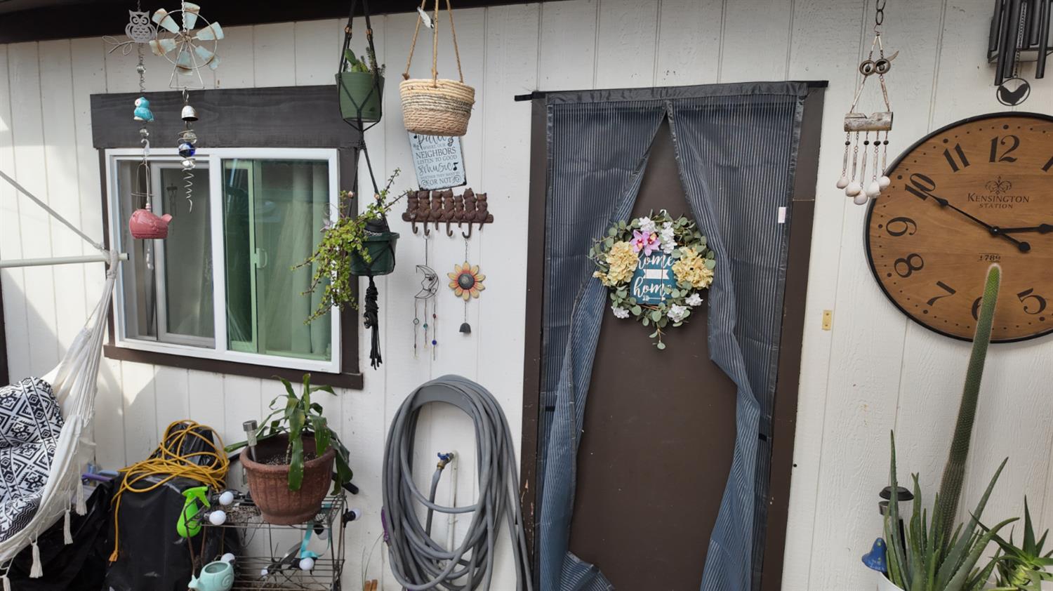 129 Phoenix Avenue Modesto, CA 95354 - Photo 20 of 21 a vase of flowers sitting on a table in front of a house