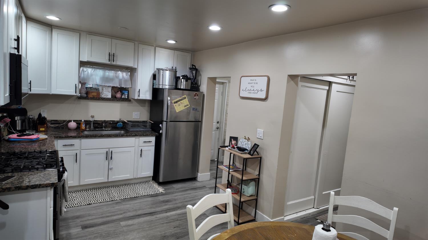 129 Phoenix Avenue Modesto, CA 95354 - Photo 10 of 21 a kitchen with a refrigerator and a sink