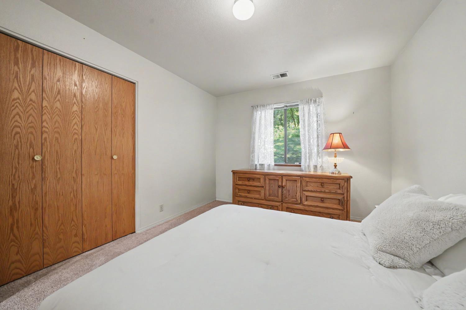 20310 State Rte 26 West Point, CA 95255 - Photo 30 of 57 a bedroom with a bed and a window