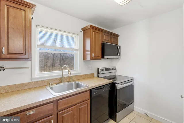 a kitchen with a sink and a microwave