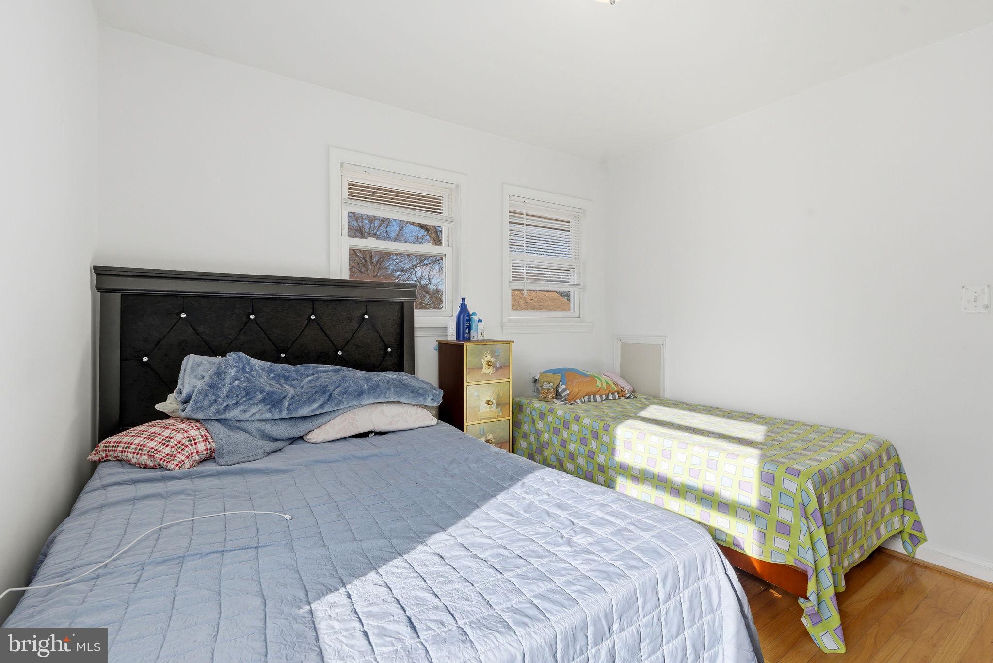 9013 Volta Street Lanham, MD 20706 - Photo 19 of 31 a bedroom with a bed and window