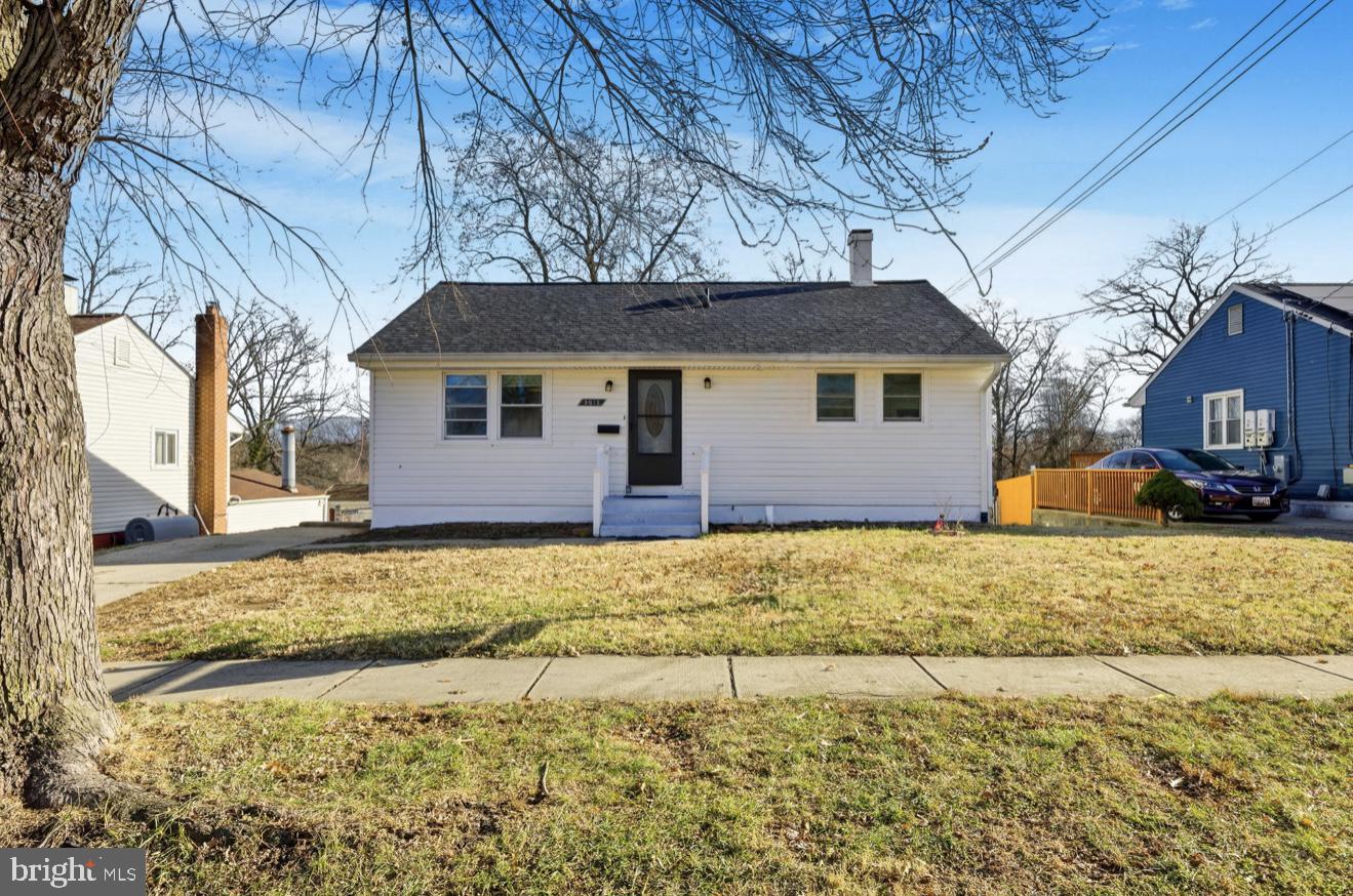 9013 Volta Street Lanham, MD 20706 - Photo 2 of 31 a front view of a house with a yard