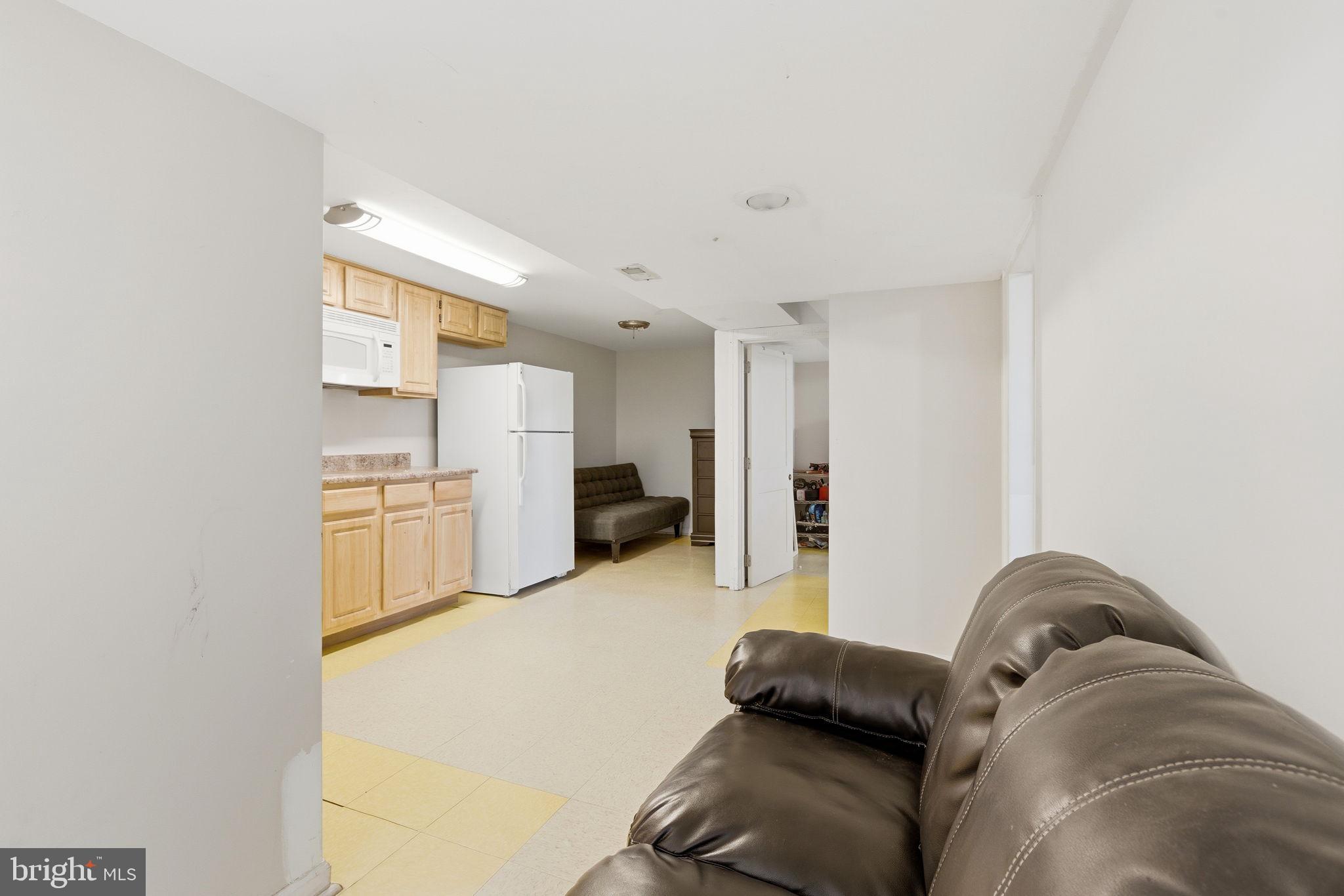 9013 Volta Street Lanham, MD 20706 - Photo 23 of 31 a living room with furniture and a couch