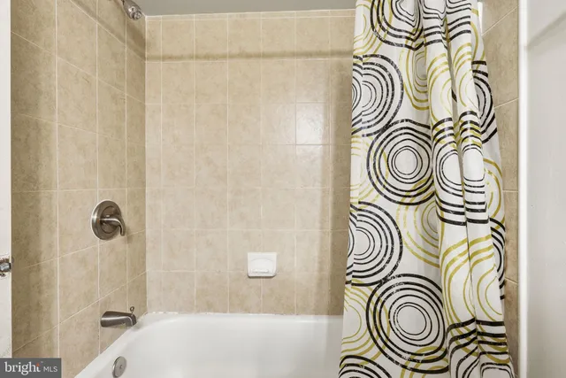 a bathroom with a sink a bathtub and a shower