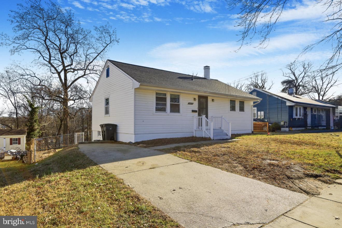 9013 Volta Street Lanham, MD 20706 - Photo 3 of 31 a front view of a house with a yard