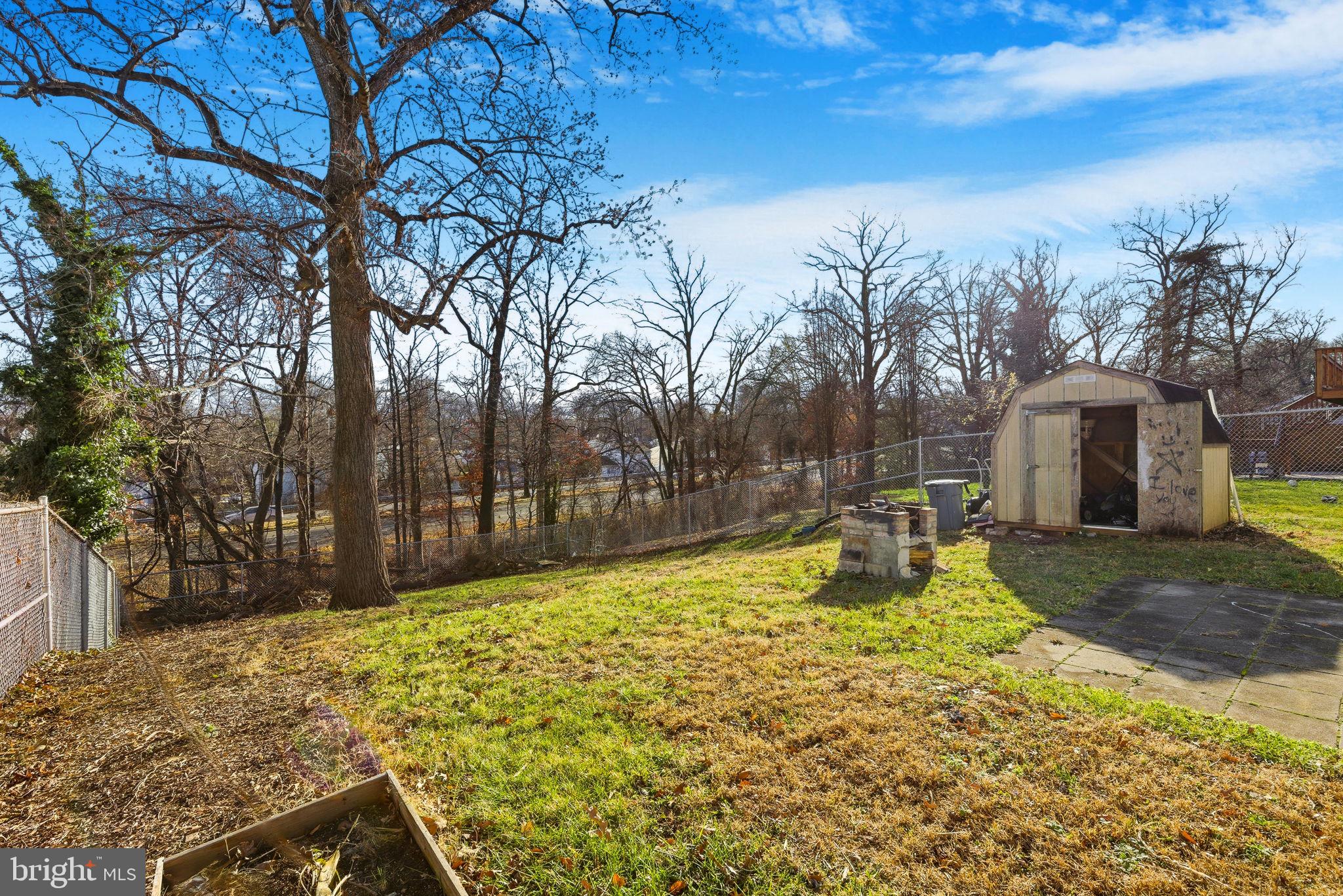 9013 Volta Street Lanham, MD 20706 - Photo 31 of 31 a view of a yard with large trees