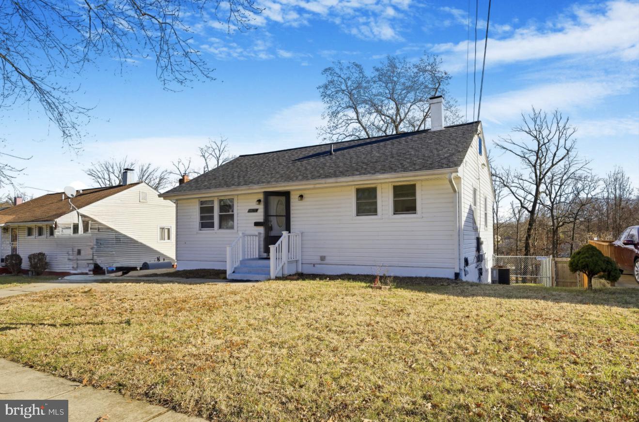 9013 Volta Street Lanham, MD 20706 - Photo 4 of 31 a view of a house with a yard