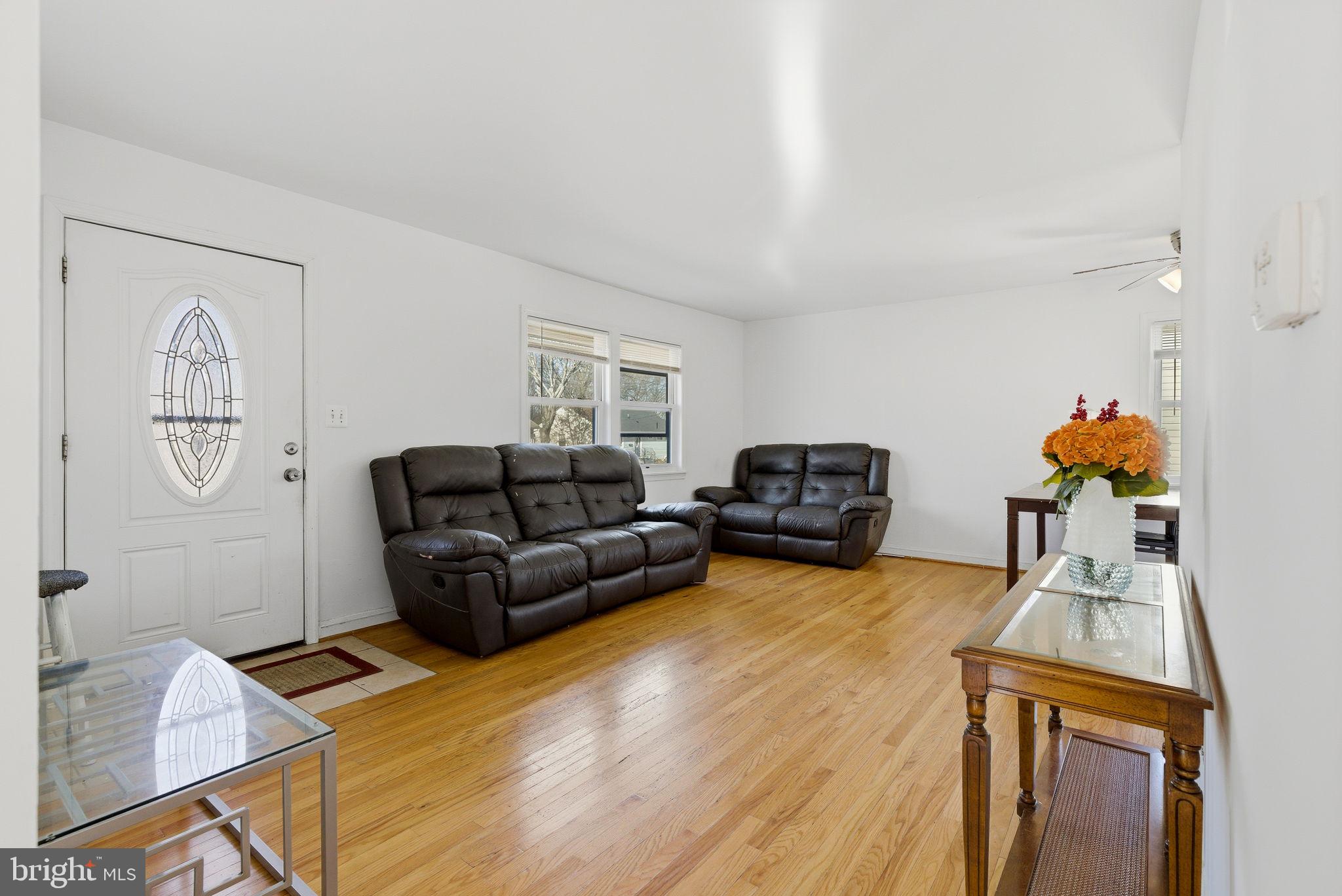 9013 Volta Street Lanham, MD 20706 - Photo 6 of 31 a living room with furniture and a flat screen tv
