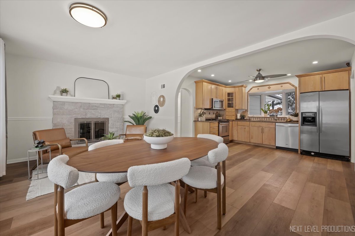 1017 South 6th Street St. Charles, IL 60174 - Photo 2 of 30 a view of a dining room with furniture and a fireplace
