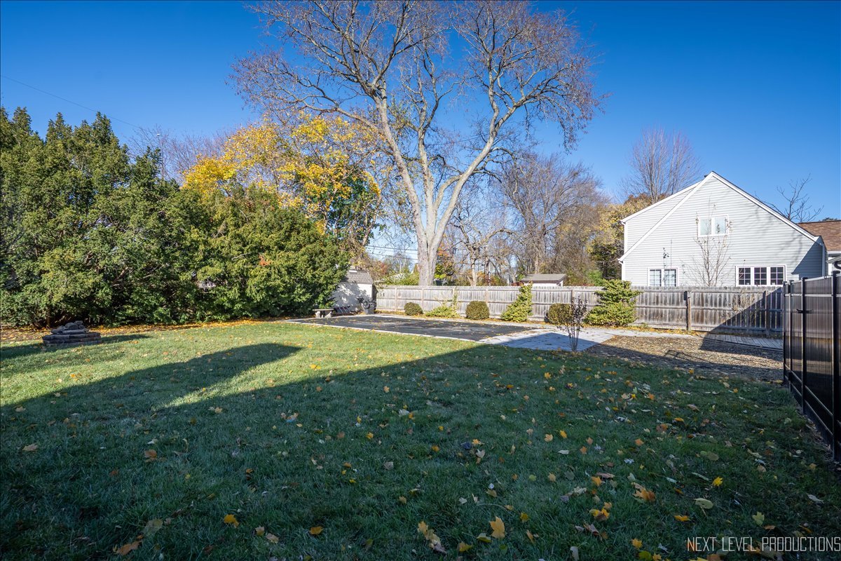 1017 South 6th Street St. Charles, IL 60174 - Photo 26 of 30 a view of backyard with swimming pool and outdoor seating