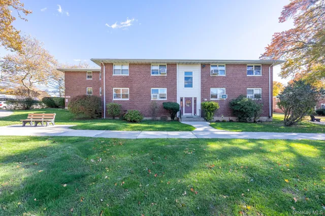 a view of a building with a yard