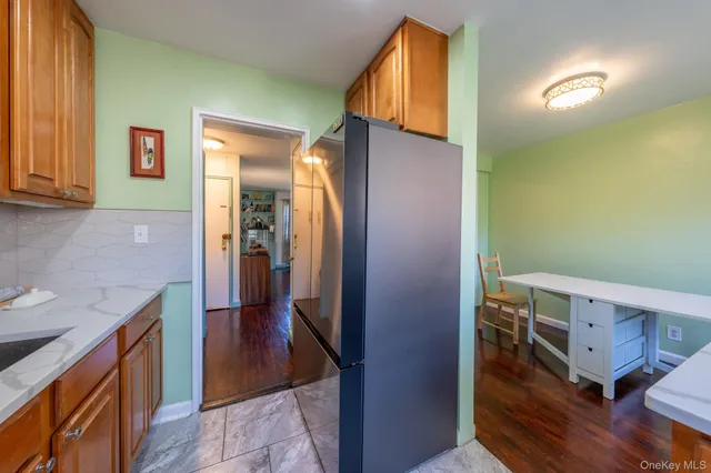 a kitchen with a refrigerator and a sink