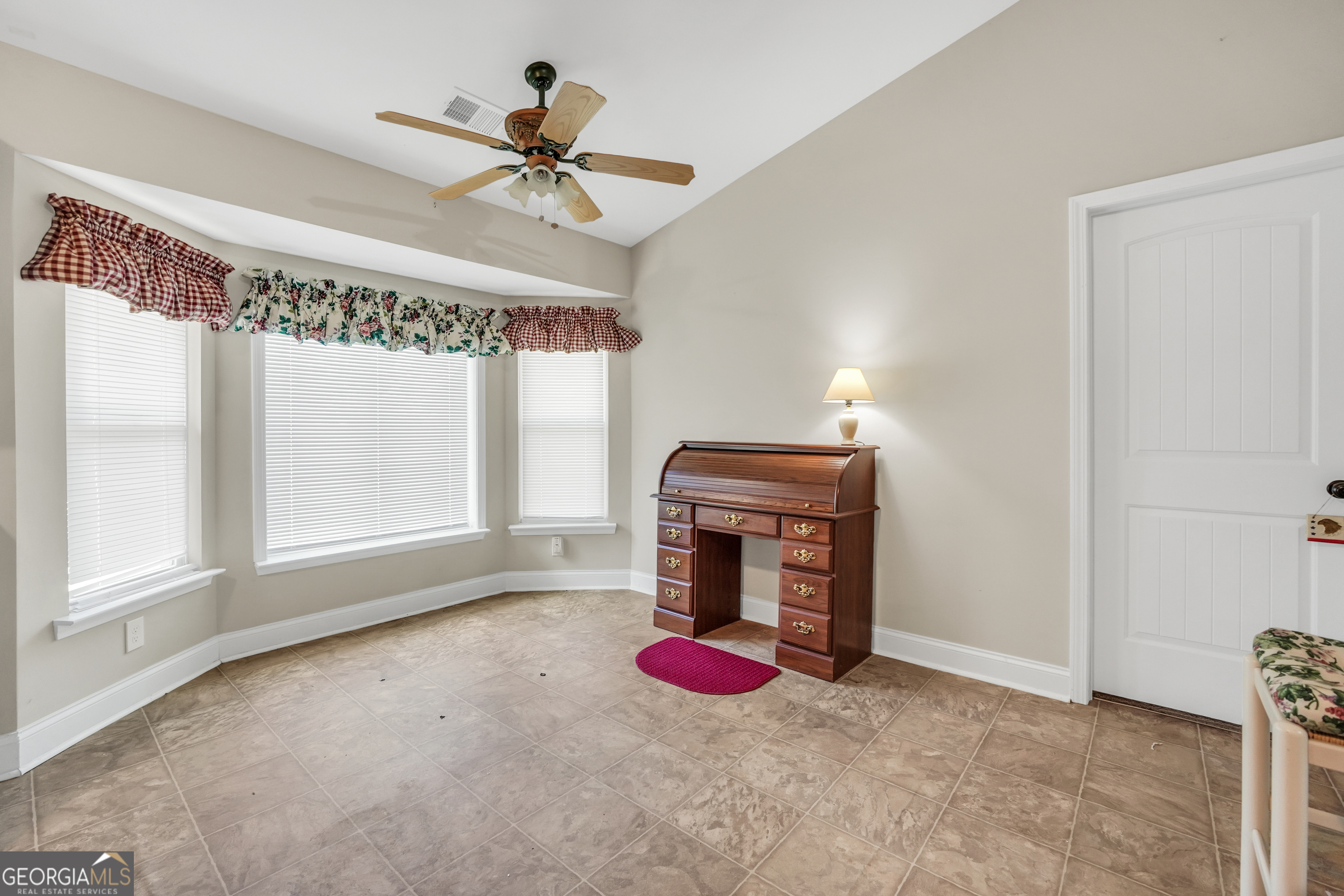 185 Wynn Road McDonough, GA 30252 - Photo 13 of 36 an empty room with windows and fan