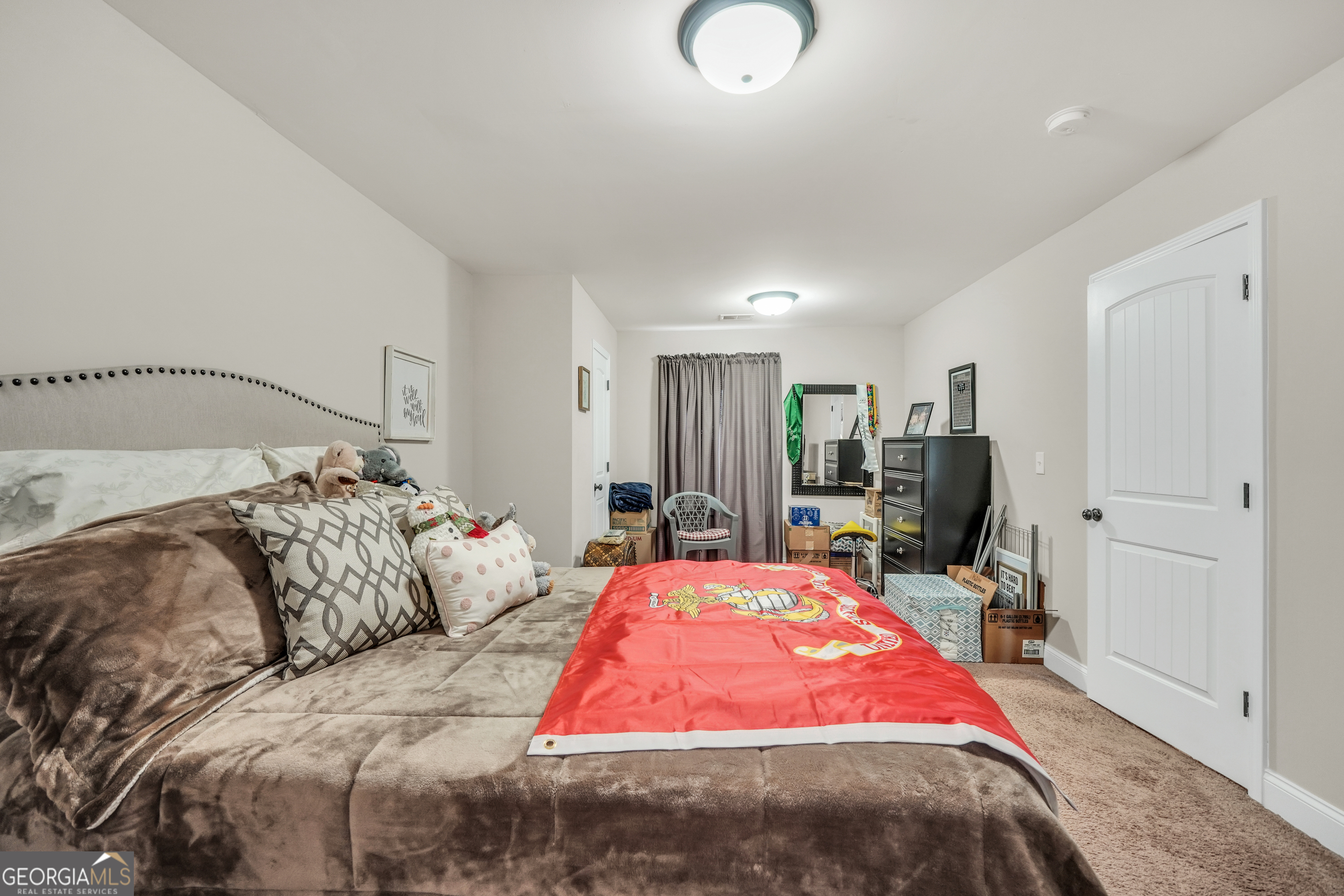 185 Wynn Road McDonough, GA 30252 - Photo 16 of 36 a bedroom with bed and large mirror