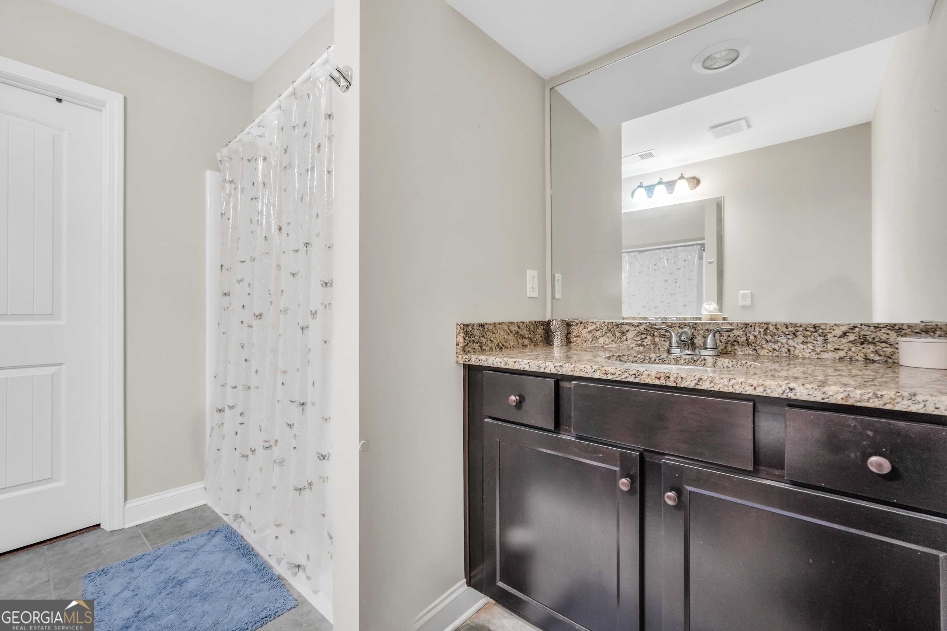 185 Wynn Road McDonough, GA 30252 - Photo 20 of 36 a bathroom with a sink and a mirror